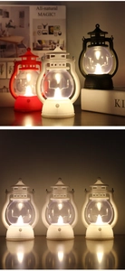 Close-up of vintage LED lanterns in three colors with flickering flame effect lights