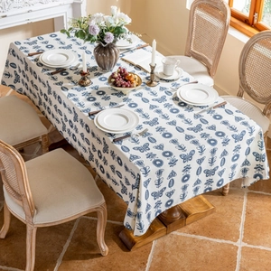 Detail of vintage blue floral and butterfly print on a cotton-linen tablecloth