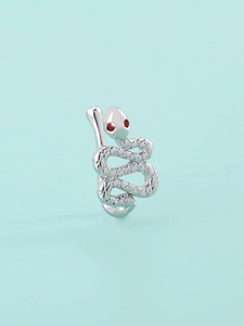 Detailed close-up of a silver snake faux nose ring with sparkling red zircon eyes