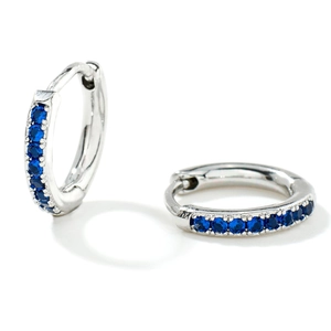Sleek silver hoop earrings with a row of sparkling blue round-cut cubic zirconia stones