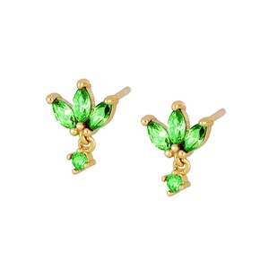 Detailed macro view of gold butterfly stud earrings with emerald green zircon stones