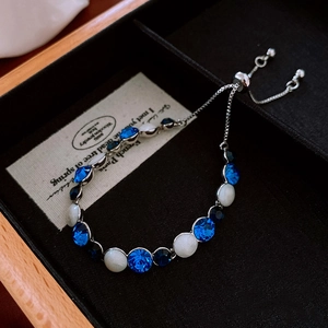 Detail of beaded bracelet with blue crystals and silver adjustable slide clasp