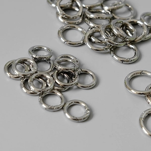Close-up of polished silver metal spring rings for DIY bag chain accessories