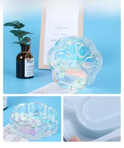 Detailed view of cat paw shaped resin mold with iridescent aurora finish for DIY crafts