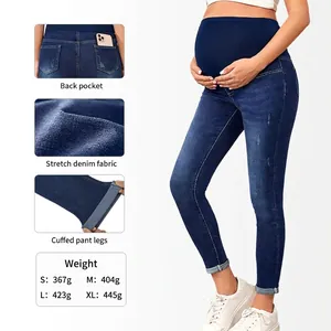 High-waisted maternity skinny jeans in dark blue denim with elastic belly support band