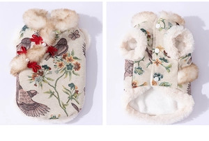 Close-up of pet Tang suit vest with floral embroidery, faux fur trim, and pearl buttons