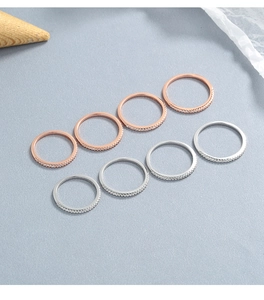 Detailed close-up of 925 sterling silver eternity rings in silver and rose gold finishes