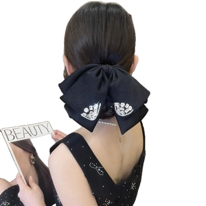 Large black fabric bow hair claw clip with rhinestones for thick hair styling