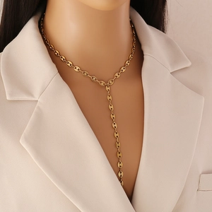 Elegant gold-tone stainless steel Y-shaped necklace with coffee bean links on a model