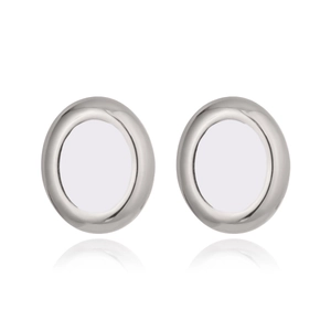 Close-up of silver oval stud earrings with polished finish and symmetric reflection
