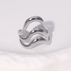 Minimalist silver wavy multi-layer adjustable stainless steel ring on white background