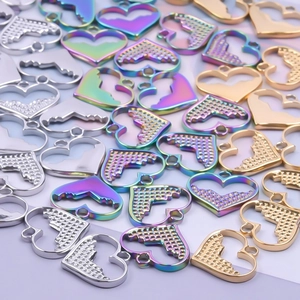 Minimalist heart-shaped stainless steel pendants in silver, gold, and rainbow finishes