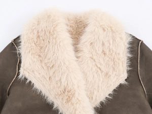 Detail of premium brown leather jacket featuring a plush cream faux fur collar texture