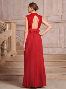 Detail of red backless party dress with sequin bodice and chiffon pleated skirt