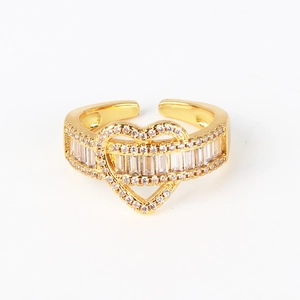 Detailed view of a gold-plated heart ring with shimmering white zircon stones inlay