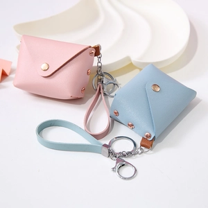 Mini PU leather keychain pouch in pink and light blue with snap button closure