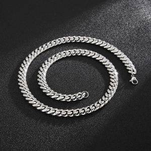 Close-up of polished 8mm silver Cuban chain necklace with secure lobster clasp detail