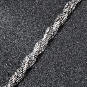 Macro shot of silver stainless steel snake bone chain with intricate twisted mesh design