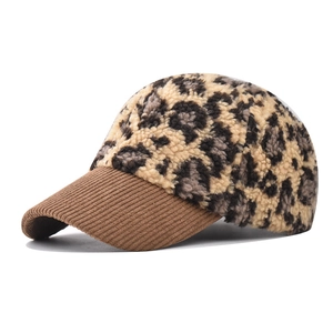 Detail of leopard print faux fur and brown corduroy brim on a stylish baseball cap