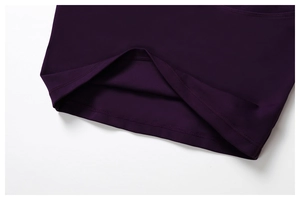Detail of double-needle stitching on the hem of dark purple elastic yoga wear