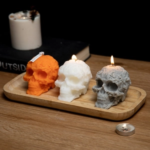 Three-piece skull scented candles in orange white and grey for Halloween home decor