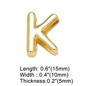 Macro shot of 18K gold plated letter K charm with precise dimensions 15mm by 10mm