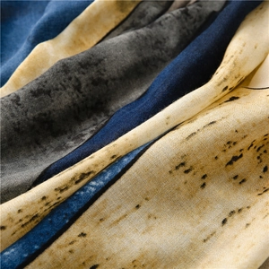 Detailed view of summer scarf with marble ink print and soft linen silk texture
