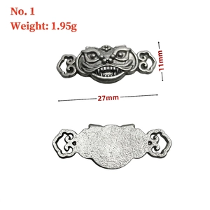 Detailed view of vintage silver vajra bell charm for Buddhist bracelet making