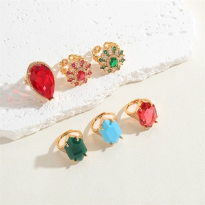 Detailed view of six luxury gold rings featuring colorful zircon flowers and gemstones