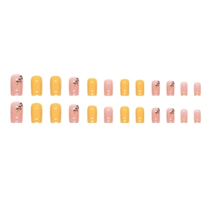 Medium square press-on nails with yellow and pink floral patterns on white background
