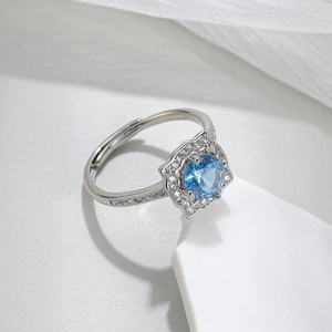 Elegant silver S925 open ring with a stunning blue gemstone and crystal accents