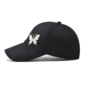 Classic black cotton baseball cap with jacquard texture and sparkling crystal butterfly