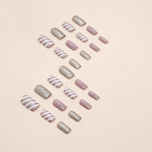 Sparkling champagne and purple diagonal stripe medium-length press-on nails with glitter