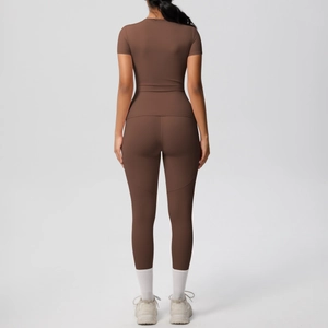Deep brown yoga set featuring high-waist leggings and short sleeve tee from back view