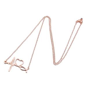 Rose gold stethoscope and heartbeat necklace with a polished minimalist heart pendant