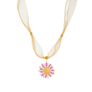Detail of flower pendant with gold chain and sheer ribbon on gold floral necklace