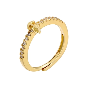 Macro shot of 18K gold plated cross ring with pavé cubic zirconia and adjustable band