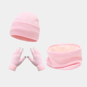 Detailed close-up of pink knitted winter set with fleece-lined neck gaiter and touchscreen gloves