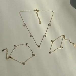 Elegant 18k gold plated jewelry set featuring zircon pendant necklace and bracelets