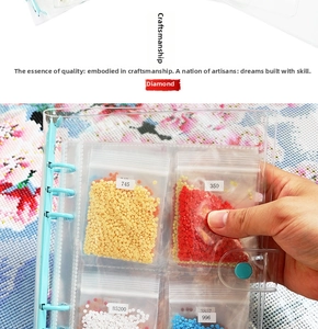 Macro shot of 5D diamond painting binder with transparent bags holding colorful beads