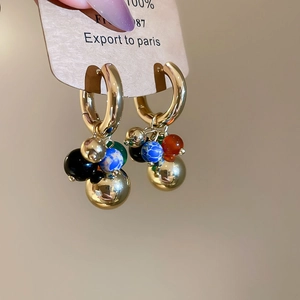 Vintage gold hoop earrings featuring a cluster of colorful stone beads in a grape design
