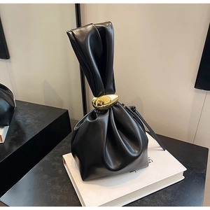 Chic black soft PU leather handbag with elegant gold metal ring and pleated detailing