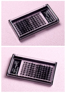 Macro detail of natural voluminous cluster false eyelashes in a pink and black box