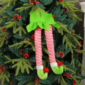 Christmas elf leg decoration with red white stripes and green felt on a festive tree