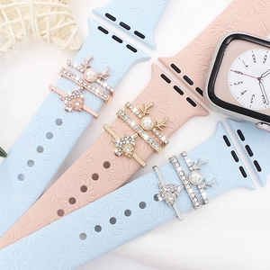 Silicone smartwatch bands with Christmas themed decorative metal charms and floral embossing