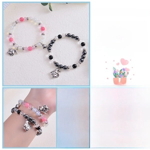 Detail view of heart magnet couple bracelets with natural stones and wizard pendants