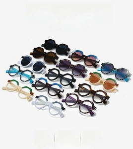 Detailed grid of geometric polygon sunglasses in black tortoise and multi-color frames