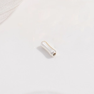 Macro view of polished S925 sterling silver bamboo style tube beads for DIY jewelry