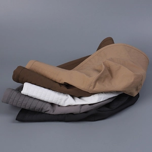 Detailed stack of five colored wide brim sun hats showing reinforced stitching and texture