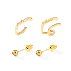 Minimalist gold ear cuff and stud set with pavé zircon stones on a white background
